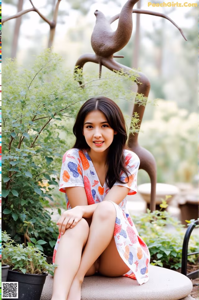 A woman sitting on a bench in a garden.