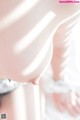 A close up of a woman's breasts in lingerie.